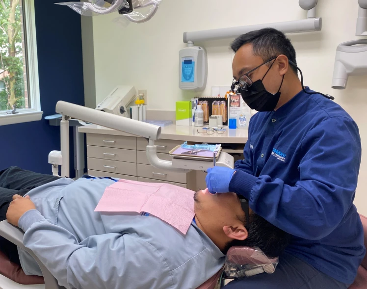 Dr. Tom working on a patient