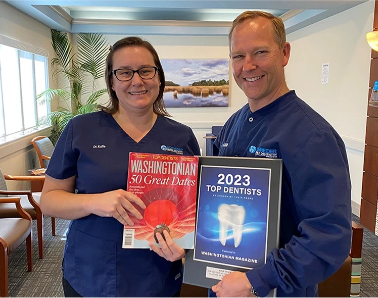 Drs. Schneider and Staub holding plaques